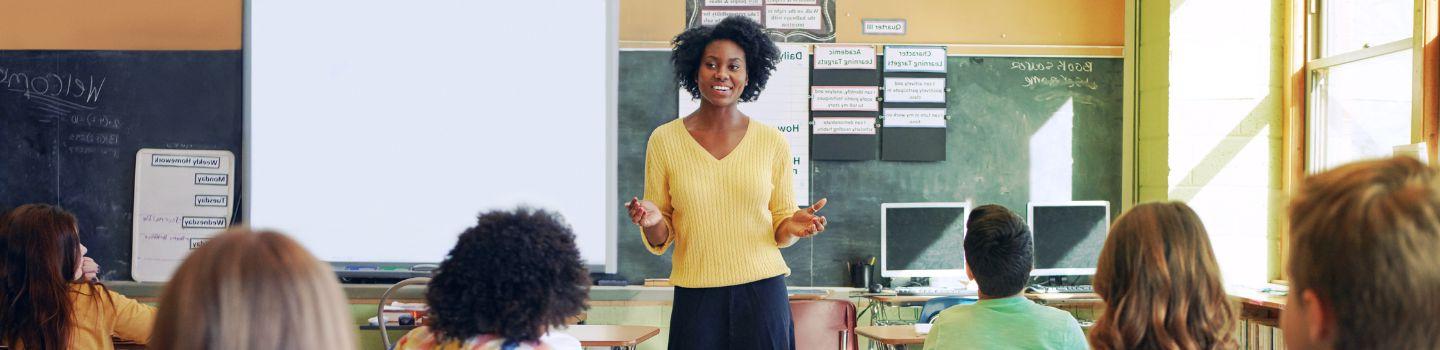 Teacher in classroom with students